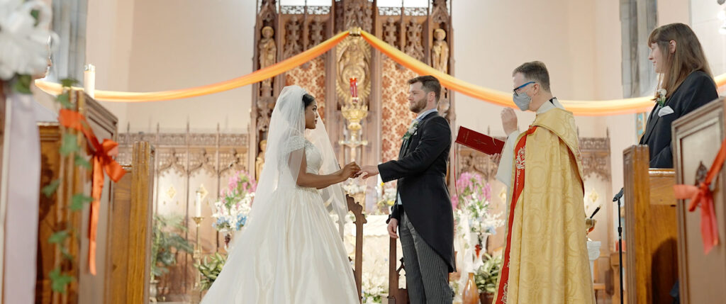 Wedding couple at altar at St Gabriel Church